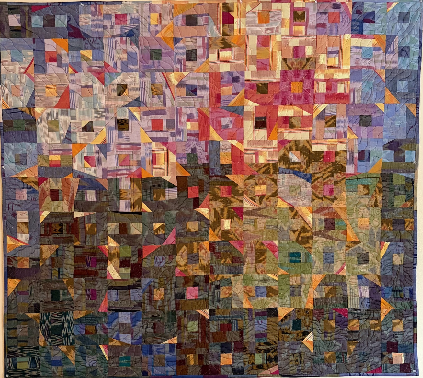 Bali scrap wall quilt with filtered light
